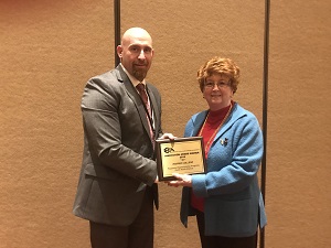 Harper College Dean Rebecca Lake receives the ICCCA Innovation Award from ICCCA President-elect Michael Boyd