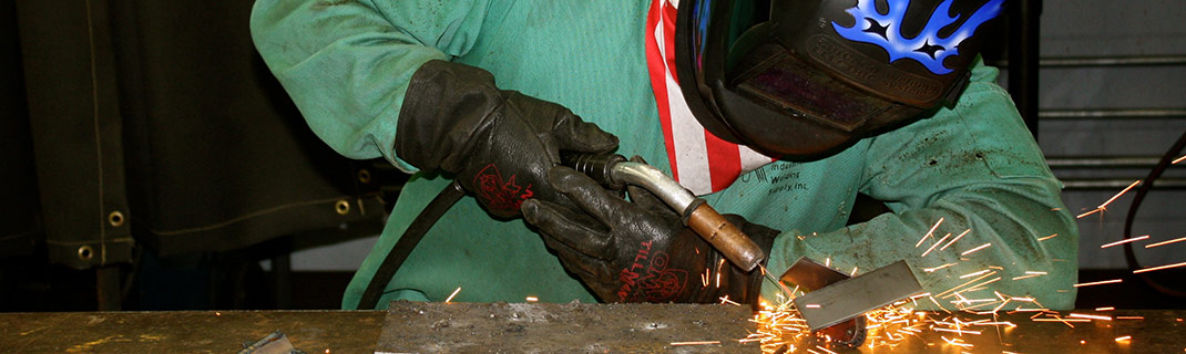 Man working with welding technology and machinery